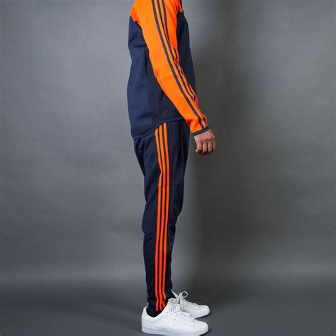 adidas anzug orange schwarz|Orange .